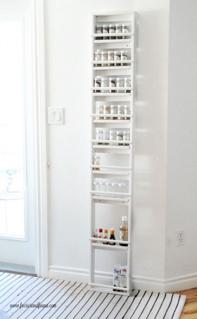 Tall DIY spice rack for a kitchen pantry.