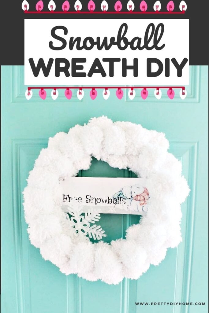A fun and cheerful large white pom pom wreath that looks like a huge cluster of snowballs.  There is a banner with two adorable polar bears in the middle.  The banner says Free Snowballs.