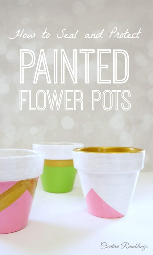 Painted flower pots with pinks, greens, whites and metallic golds.