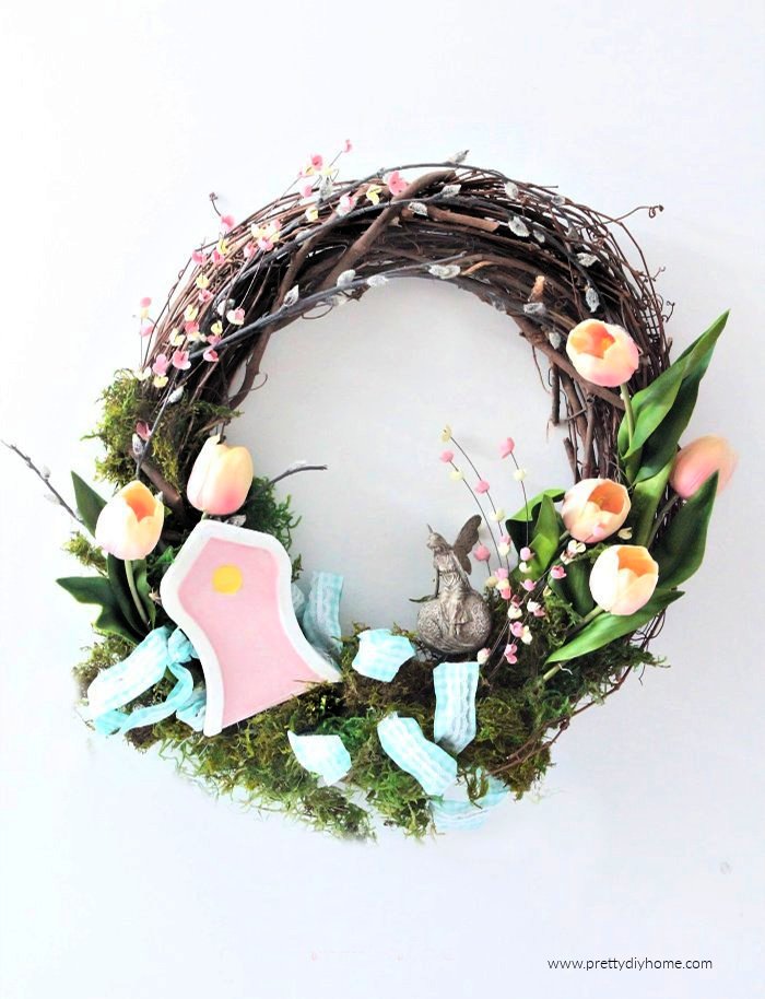 A colourful Spring wreath craft with a fairy garden.