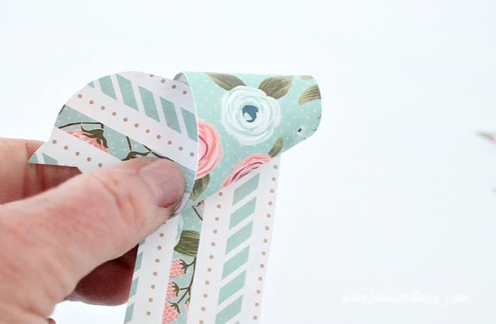 Folding paper into pretty origami birds for Spring. An easy origami craft.