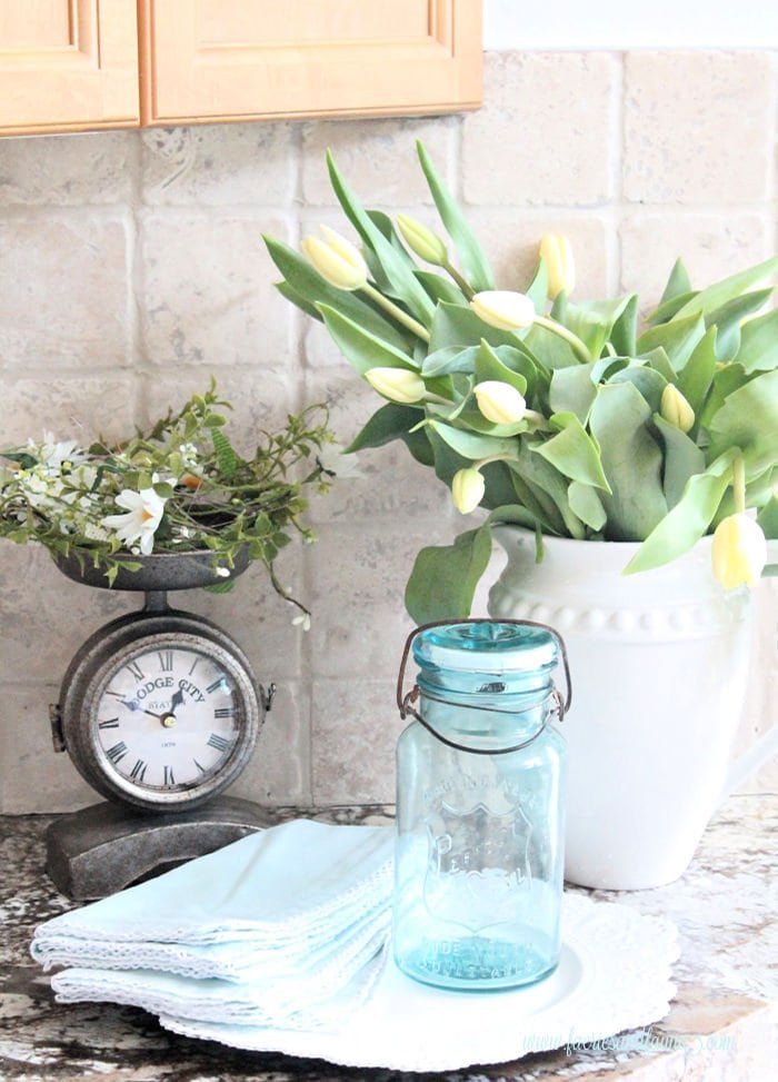 A Spring arrangement for the kitchen using a mason jar solar light.