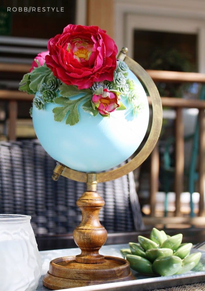 DIY Spring decor idea using an repurposed globe. and flowers.