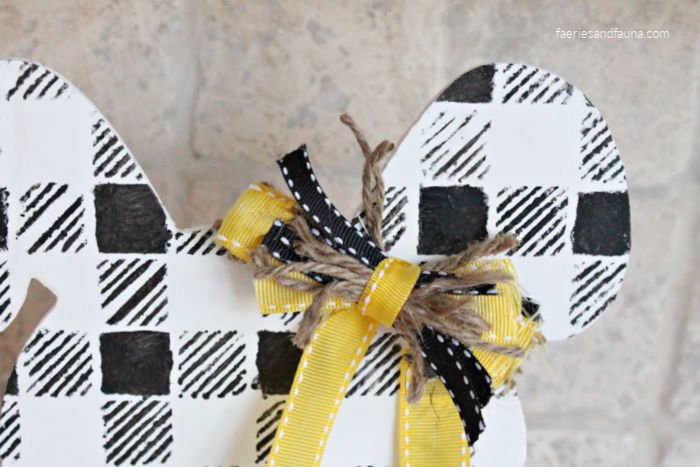 How to make a small messy bow using ribbon, twine and fabric.