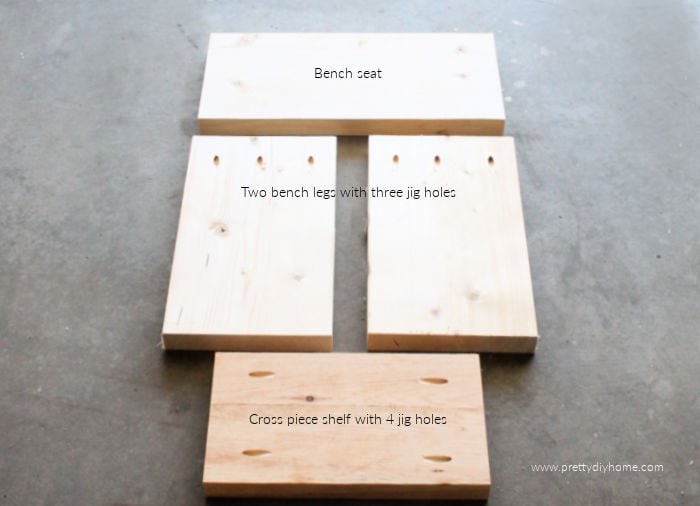 The seat, legs and cross piece of a DIY bench, with the pre done kreg jig holes.