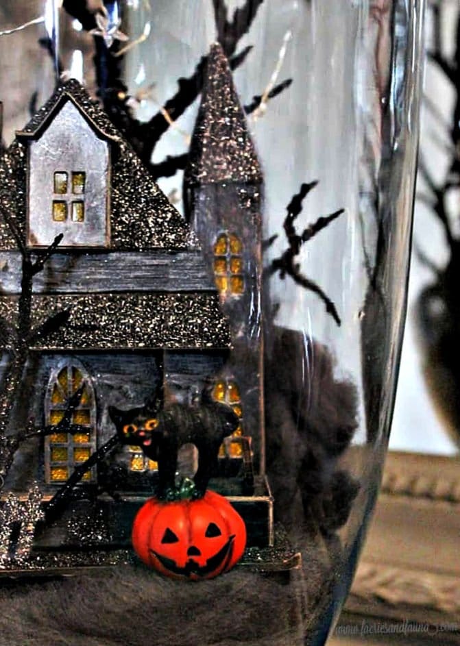 A Haunted house Halloween Diorama with a black cat and jack-o-lantern.