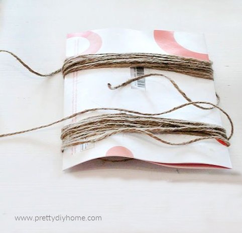 Twine wrapped around paper to create tassles