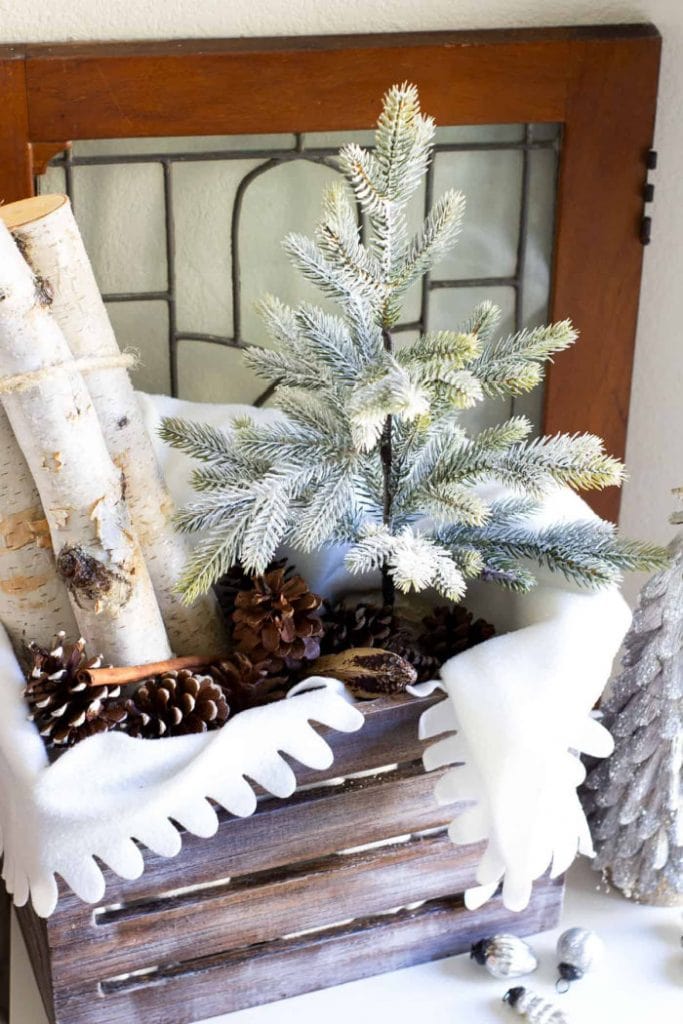 Soft icy green Christmas ornaments with a flocked tree and pine cones. A Christmas decor tour for the holidays.