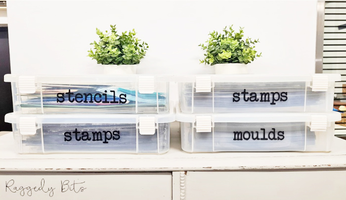 Four 12 by 12 size plastic craft containers with DIY craft labels to organize molds, stencil and supplies.