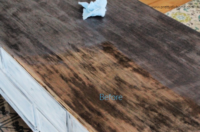 How to refinish veneer furntiure by adding stain and then wiping it off on a coffee table greige refinish project.