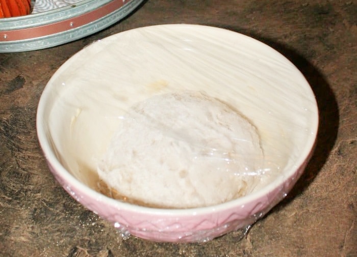 Mixed butterhornyeast dough made the night before covered in plastic wrap.