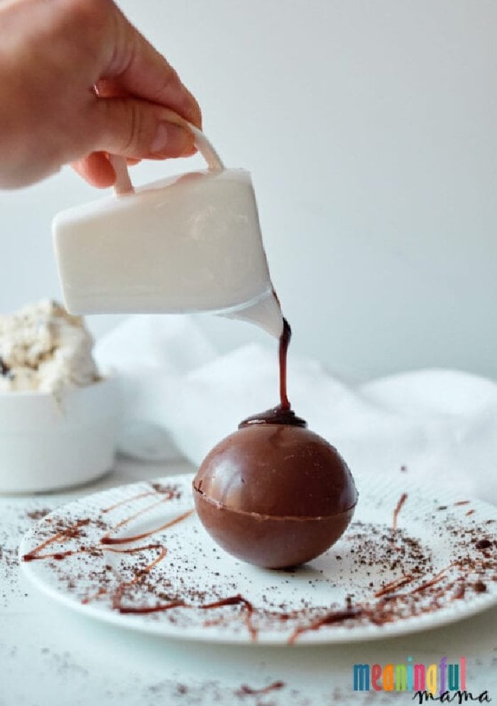 An oreo ice cream dessert served in a chocolate bomb.