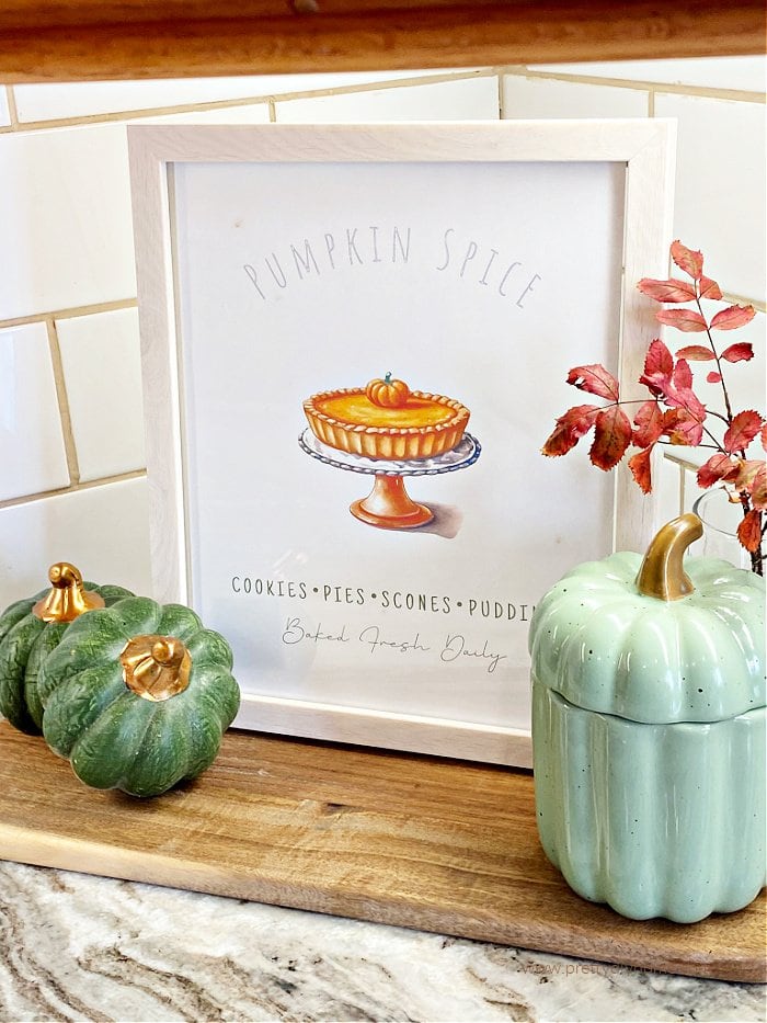 Fall DIY Home Decor using preserved fall branch, a free fall printable and dollar store pumpkins.