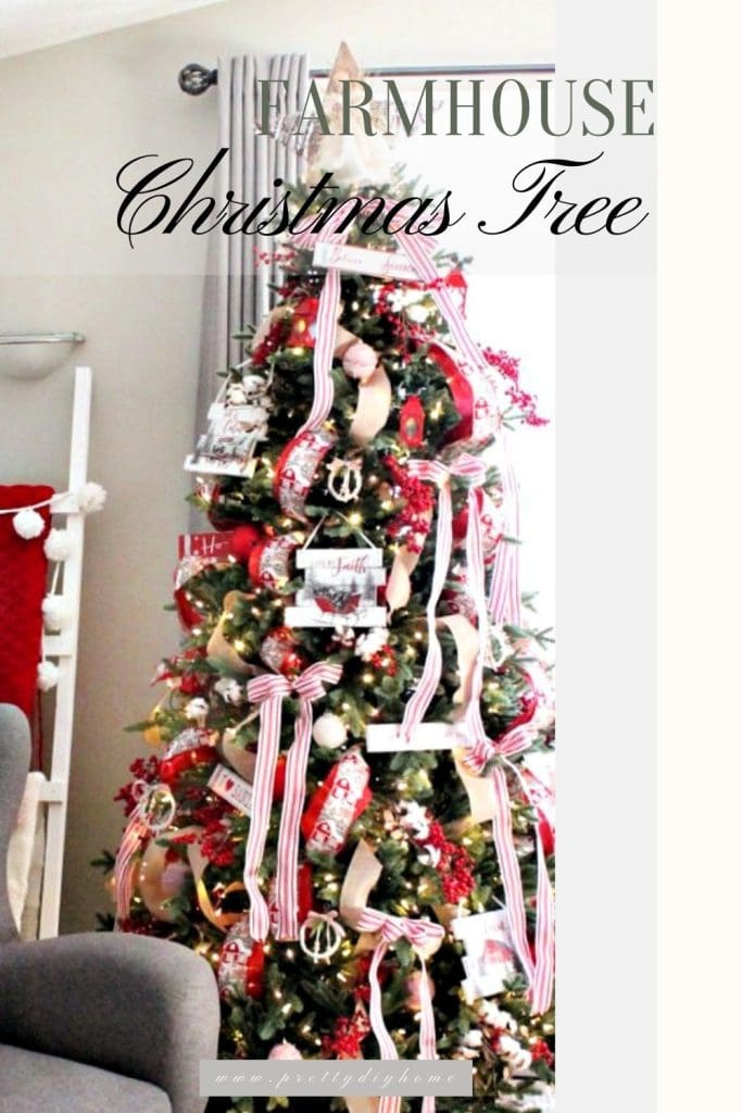 A farmhouse cChristmas tree featuring barn printed ribbon, wagon ornaments, wood signs, red lanters, red berries and highlighted with red and white striped ticking ribbon.