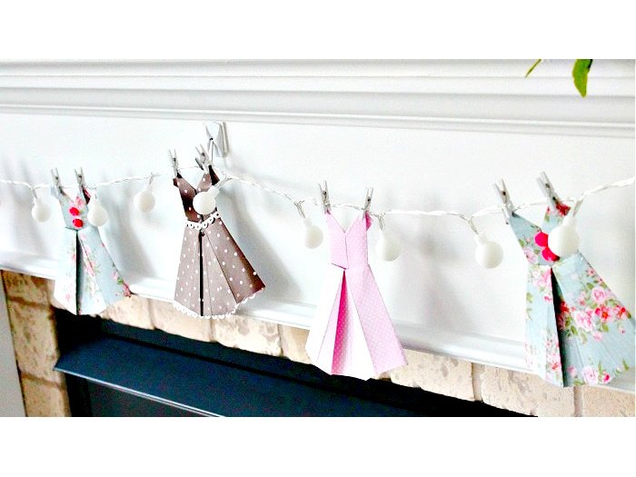 How to Fold paper dresses and then use them for a pretty paper banner.