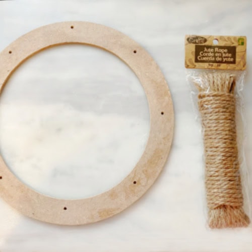 A 12 inch wood dollar tree wreath form and twine for making an Easter wreath