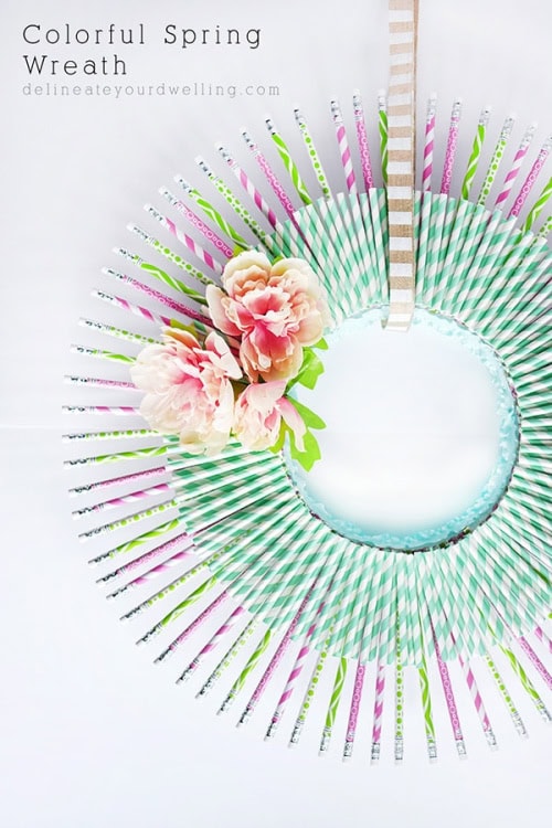 A bright and cheerful diy Spring wreath made using straws and brightly colored pencils.  A unique and fun DIY spring wreath idea.