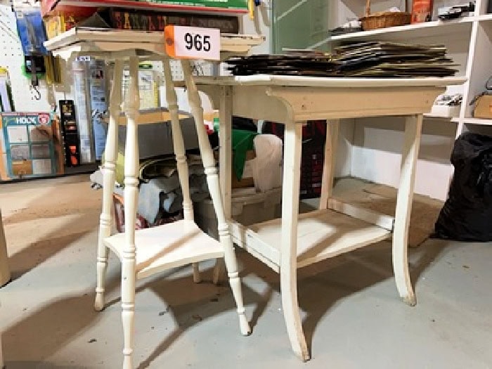 Two old and damaged antique side tables coated in layers of thick white paint. The before pictures for an occasional table makeover idea.