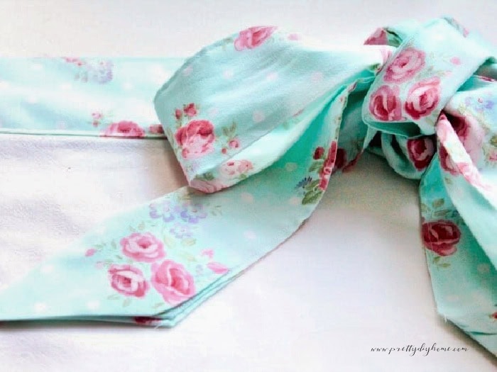A pretty bow from a DIY Apron bow made with the ties. It shows off the pretty cottage fabric.
