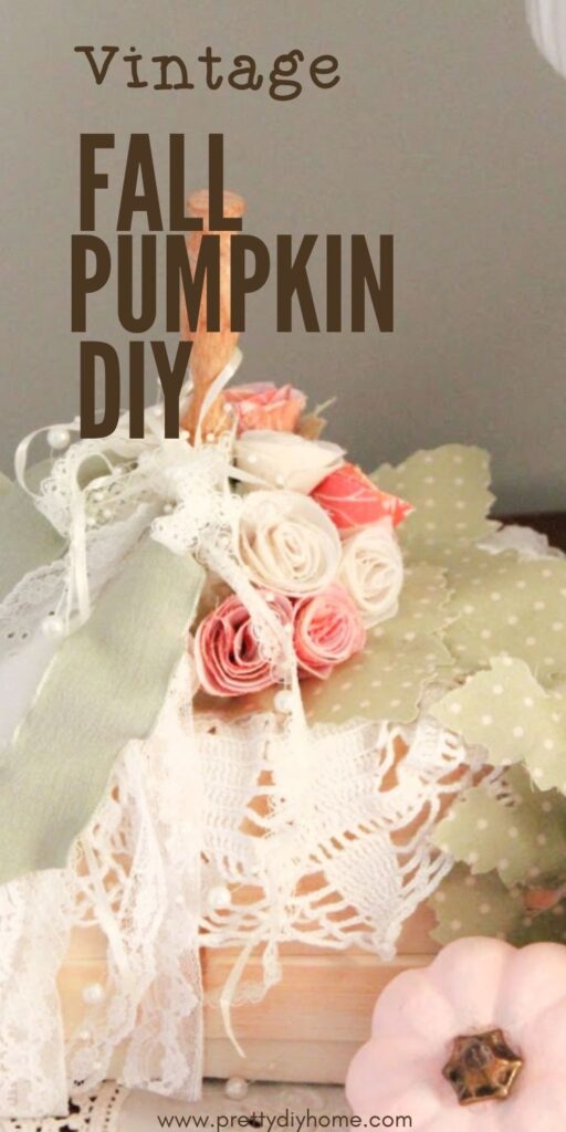 A pumpkin craft with beautiful rolled fabric roses, and ties ribbon lace, aand vintage crocheted doily.