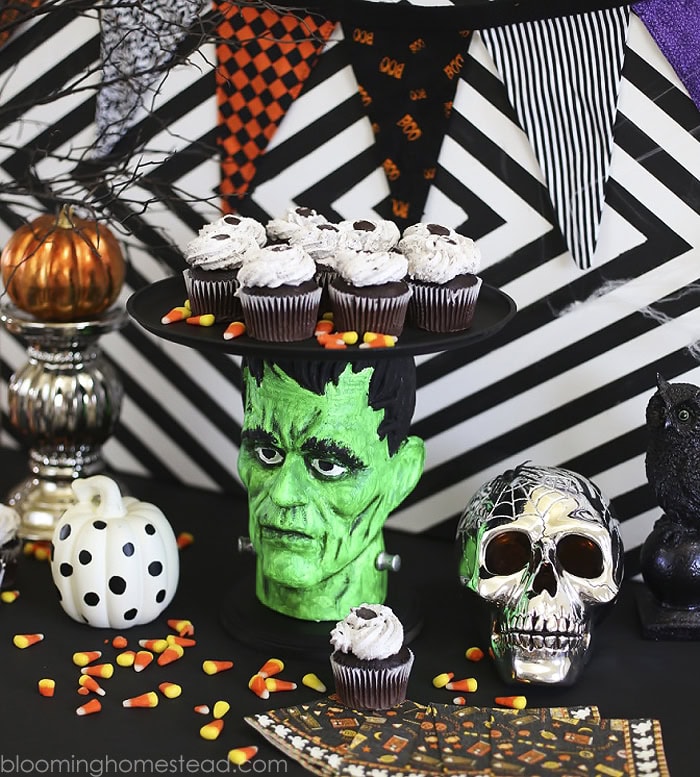 A very fun and colorful Frankenstein cupgoard holder. It makes a great cenerpiece for a foyer or food buffet because its so brightly colored in green.