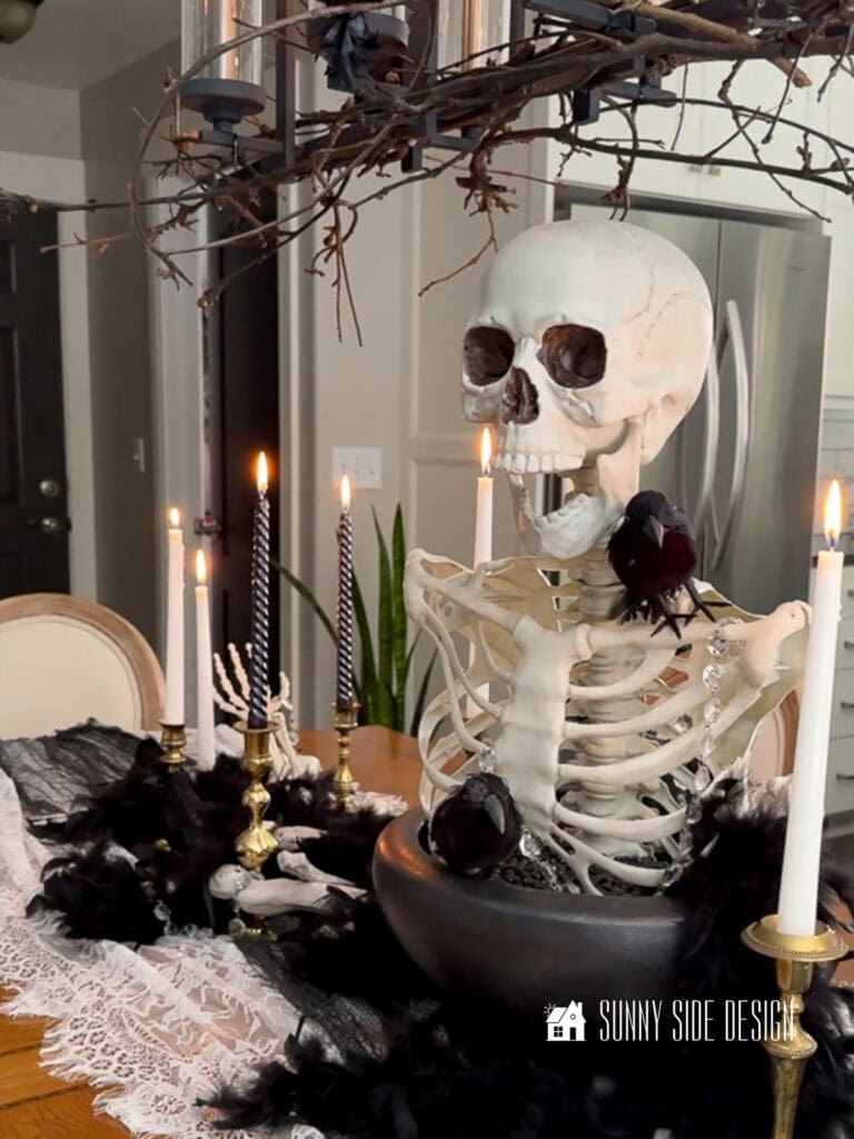 A large bowl filled with a skeleton thats been picked apart by crows. Its eerie and creepy, yet very elegant and pretty at the same time.