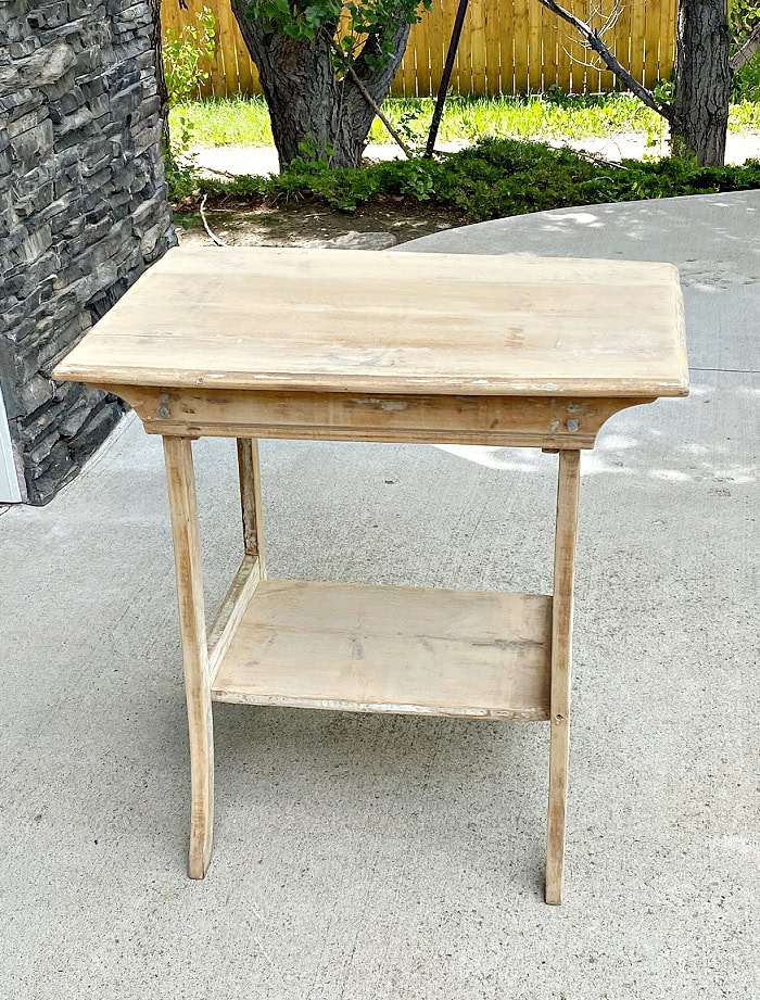 An antique table thats been repaired and sanded for painting.  Its almost sanded down to wood.