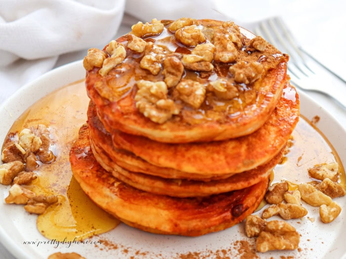 A large stack of 5 pumpkin spice pancakes.