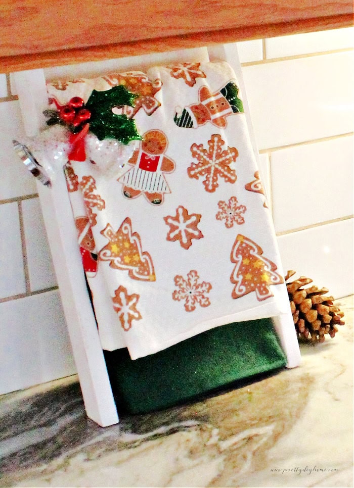 A new christmas towel hanging on a towel hanger, as an example of an early to purchase item you can buy early and not use right away.