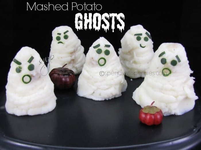 Adorable piped mounds of piped potatoes to look like ghosts.  Each ghost has a cut face made using zucchini bits.