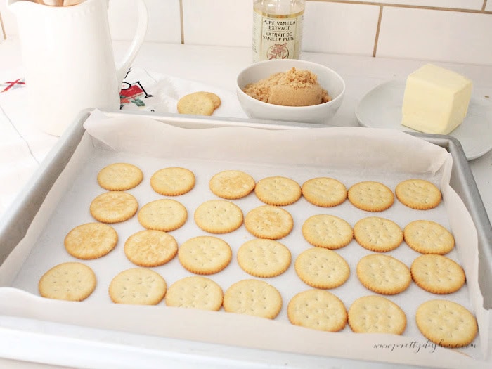 Lining a baking sheet with Ritz crackers for Christmas toffee