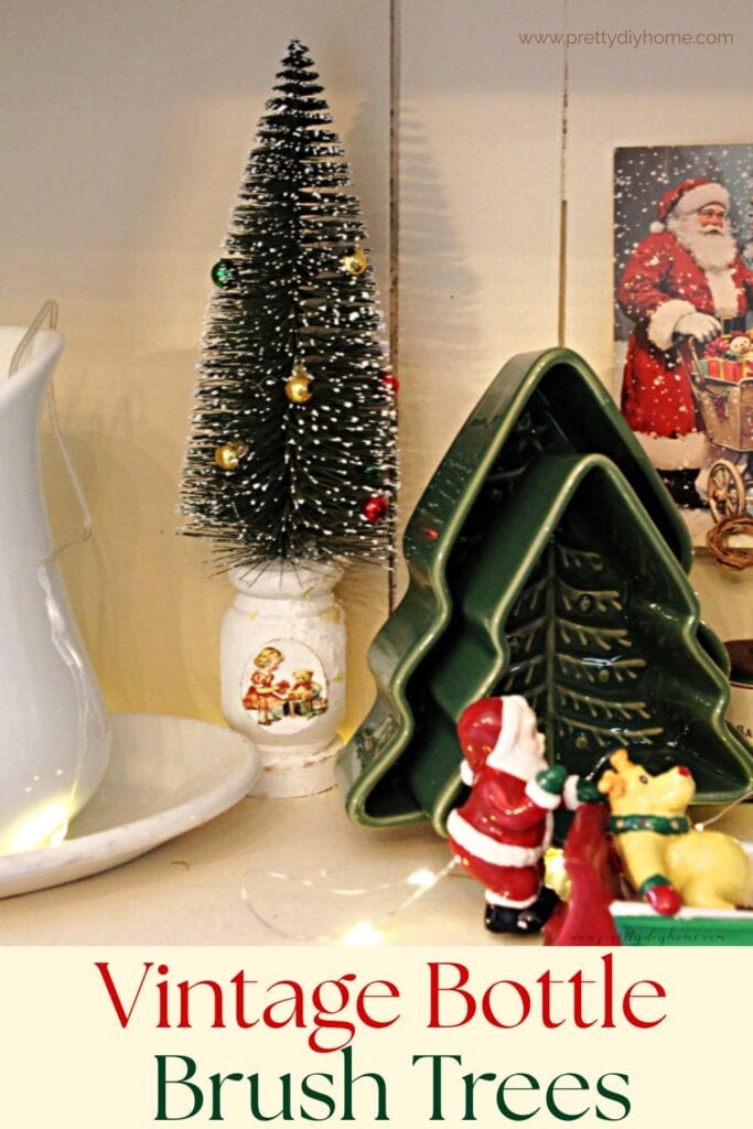 Vintage style bottle brush tree Christmas decor made from painted wooden spindles in soft greens and whites.