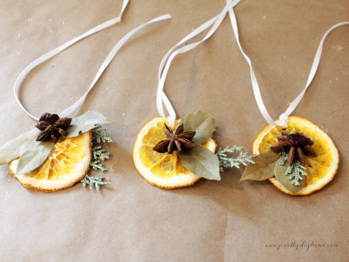 Dried orange decorations with ribbons for vintage Christmas mason jar decorations.