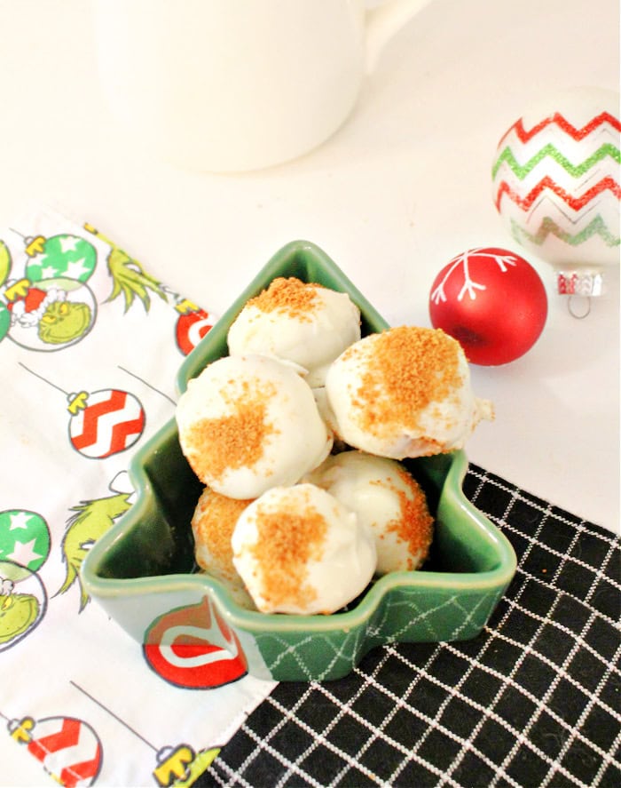 Finished gingerbread truffles on a green Christmas tree shaped serving plate ready to enjoy.