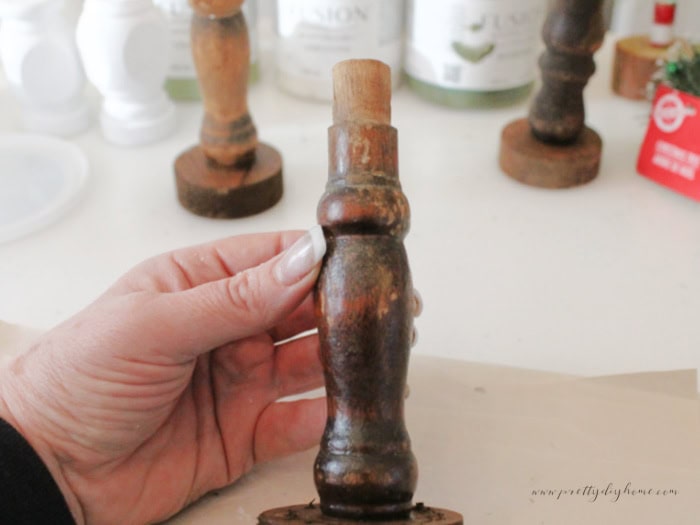 Close-up of a spindle showing its original vertical wear marks for reference before painting.