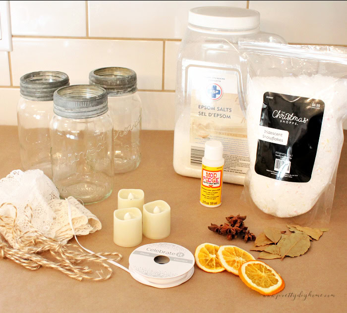 Supplies for a vintage Christmas mason jar centerpiece craft.