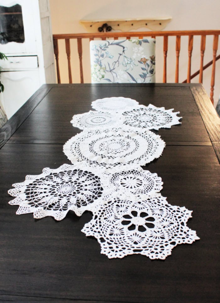 http://prettydiyhome.com/wp-content/uploads/2026/01/doily-craft-table-runner-walnut-table-end-view.jpg