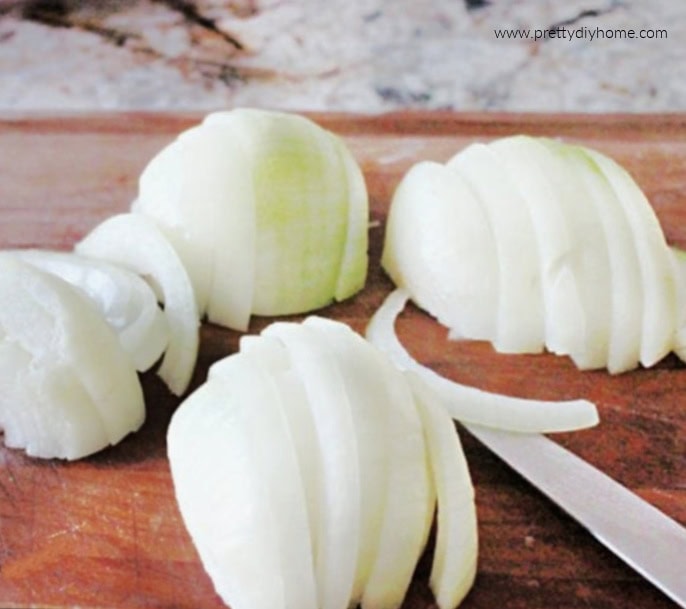 Onions sliced into half-rings for French onion soup