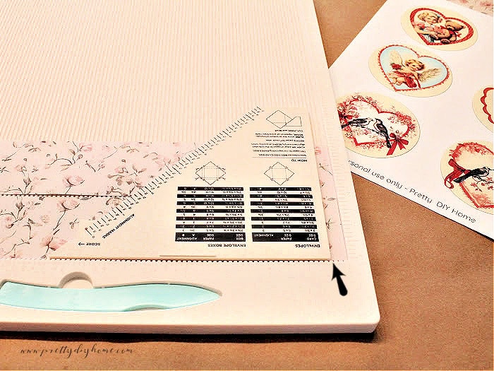 Scoring two paper strips at the same time on a scoring board for a Valentine paper medallion