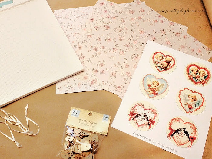 Supplies for making a vintage Valentine paper medallion banner, including scrapbook paper, ribbon, glitter, and printable centers