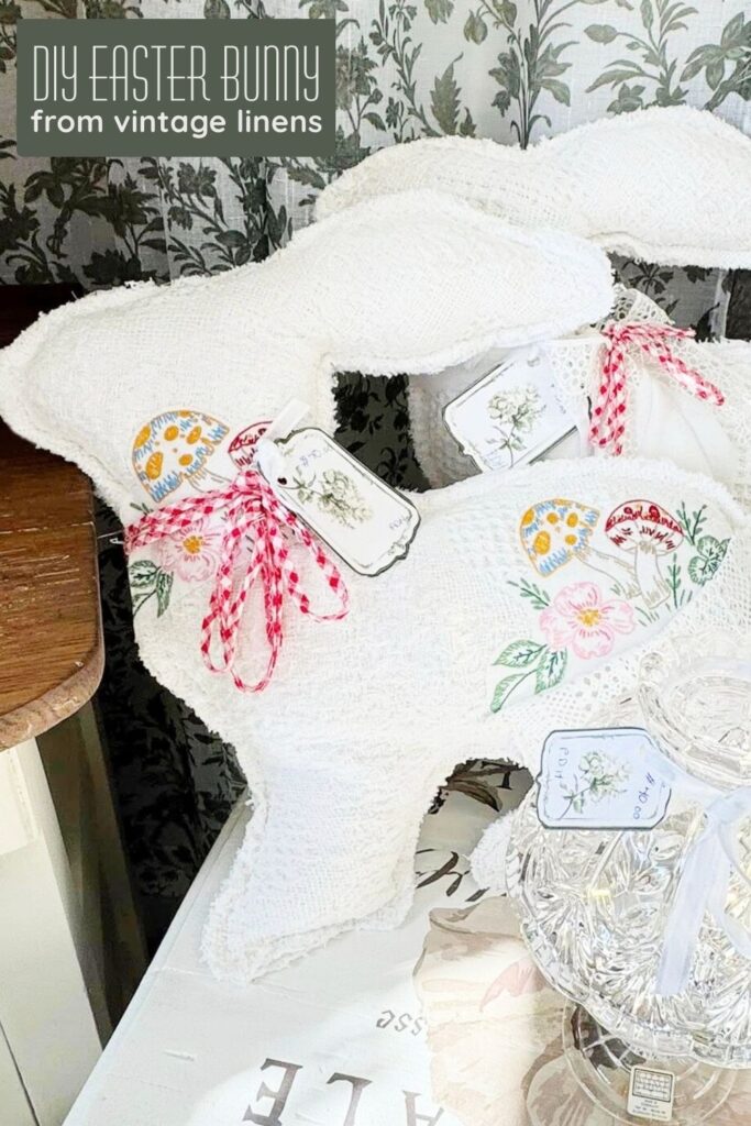 DIY Easter bunny made from repurposed vintage linens displayed in a vintage booth setting.