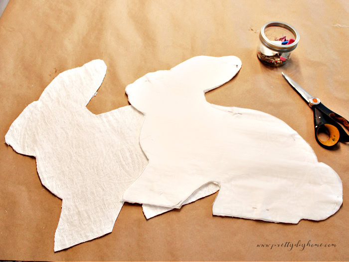 Cutting bunny fabric pieces using a parchment paper pattern template