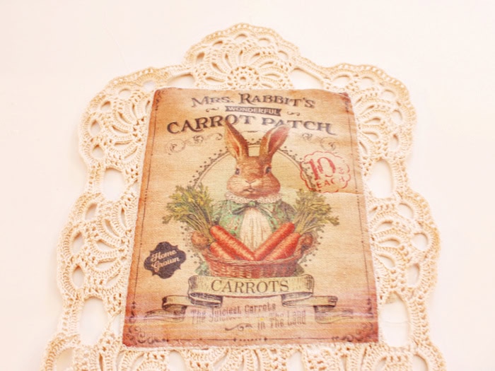 Printed bunny panel sewn onto a crochet doily for the DIY bunny wall pocket.