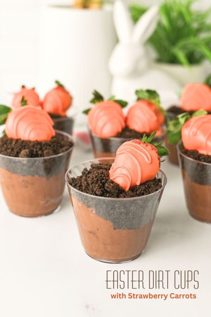 Easter dirt cups topped with Oreo crumbs and strawberry carrots for a fun Easter dessert