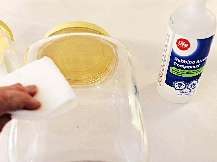 Wiping glass jar with rubbing alcohol before applying transfer.