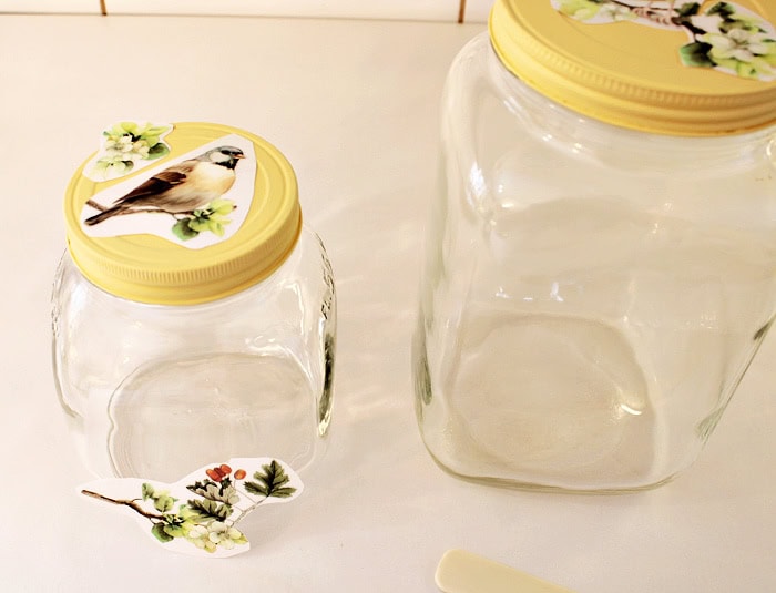 Painted jars with transfers placed on lids and glass to plan placement.