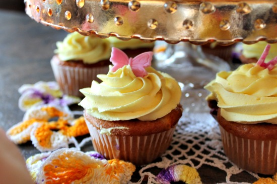 Saskatoon cream cheese filled cupcakes with yellow swirl icing.