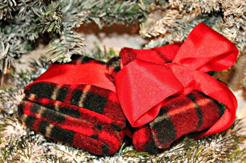 Handmade reusable hand warmers made out of red tartan fleece.