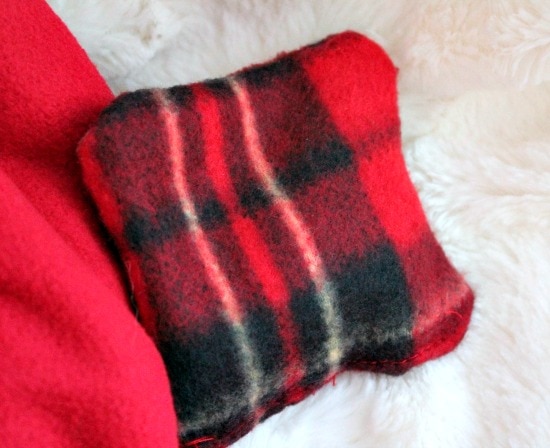 Handmade hand warmers, an easy DIY Christmas gift, made using plaid fabric.