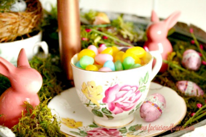 Candy in a teacup as part of a mini Easter egg hunt for Spring or Easter decorating ideas.